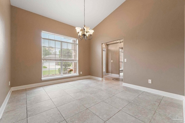 7850 Amethyst Dr, Pensacola, FL 32506 - empty room with a chandelier, light tile patterned floors, lofted ceiling, and baseboards