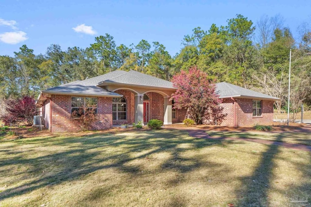 view of front of house with brick siding and a front yard