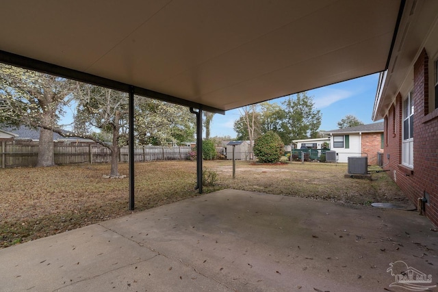 view of patio with a fenced backyard and central AC