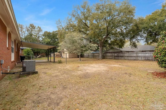 view of yard featuring central air condition unit and a fenced backyard