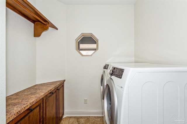 washroom with washing machine and dryer