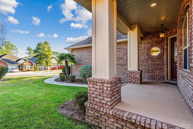 doorway to property featuring a porch and a yard