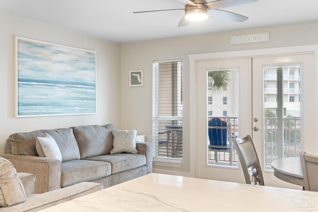 living room with french doors and ceiling fan