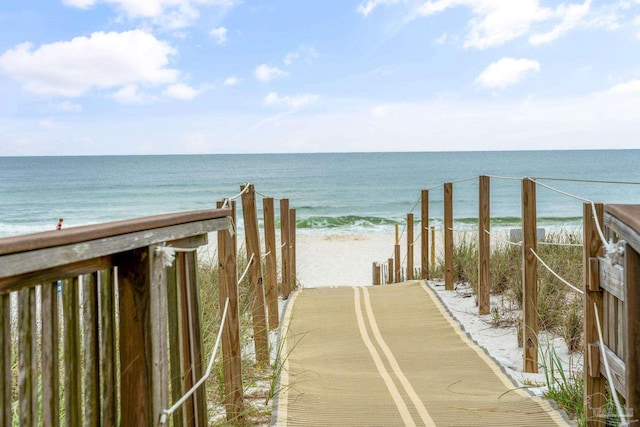 view of property's community featuring a water view and a view of the beach