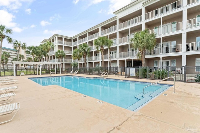 view of swimming pool with a patio