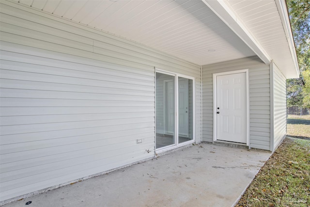 property entrance with a patio