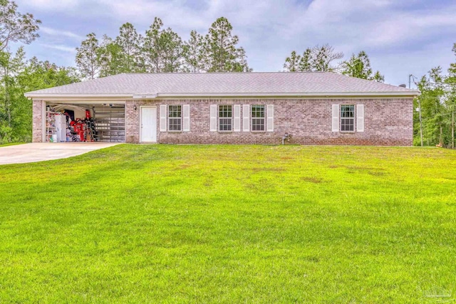 ranch-style home with a garage and a front lawn