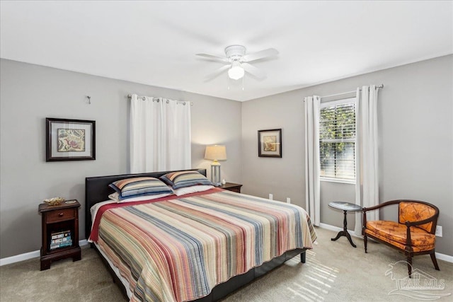 bedroom with ceiling fan and light colored carpet