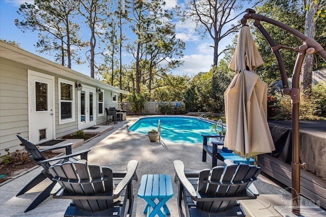 view of pool featuring a patio