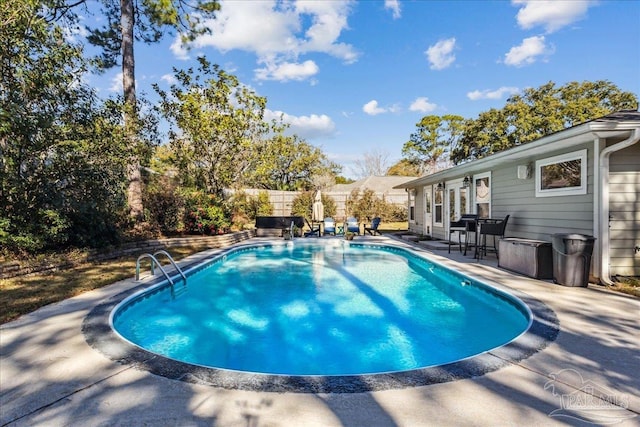 view of pool featuring a patio area