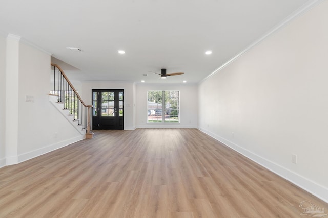 unfurnished living room featuring baseboards, recessed lighting, stairs, crown molding, and light wood-type flooring