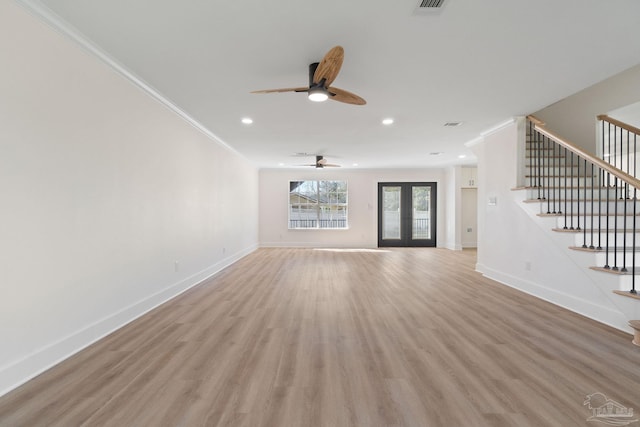 unfurnished living room featuring ornamental molding, a ceiling fan, and light wood finished floors