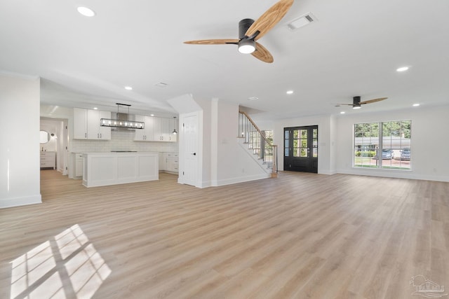 unfurnished living room featuring recessed lighting, visible vents, ceiling fan, and light wood-style flooring