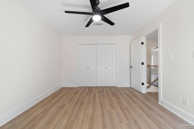 unfurnished bedroom with light wood-type flooring, visible vents, and baseboards