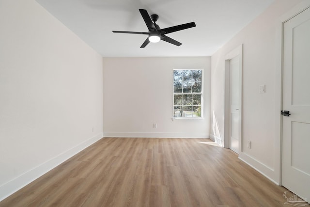 unfurnished bedroom featuring ceiling fan, baseboards, and light wood-style flooring