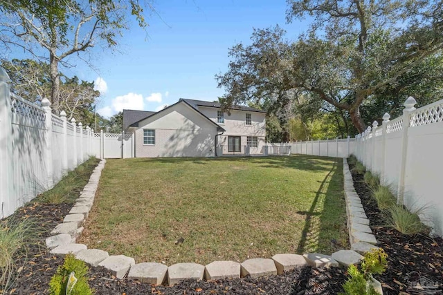 view of yard with a fenced backyard