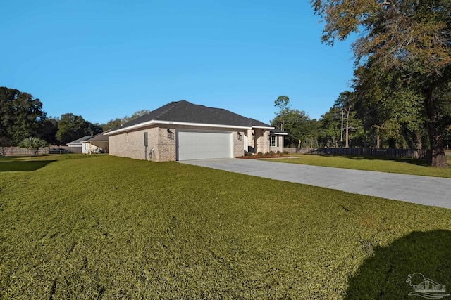 view of side of property with a garage and a yard