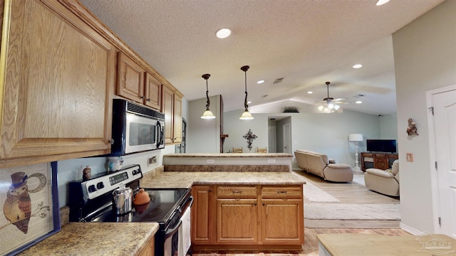 kitchen with stainless steel electric range oven, light countertops, hanging light fixtures, open floor plan, and vaulted ceiling