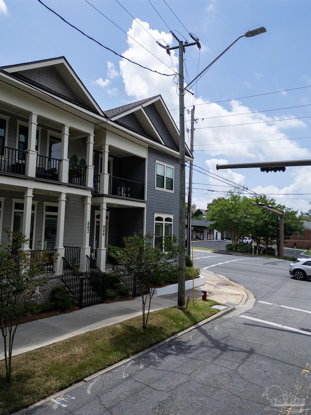 800 N Baylen St, Pensacola, FL 32501 - view of side of home featuring a balcony and uncovered parking