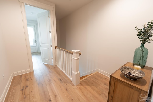 800 N Baylen St, Pensacola, FL 32501 - corridor featuring an upstairs landing, light wood-style floors, and baseboards