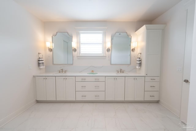 800 N Baylen St, Pensacola, FL 32501 - bathroom with marble finish flooring, baseboards, and double vanity