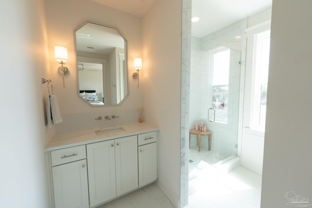 800 N Baylen St, Pensacola, FL 32501 - bathroom featuring a marble finish shower, plenty of natural light, vanity, and marble finish flooring