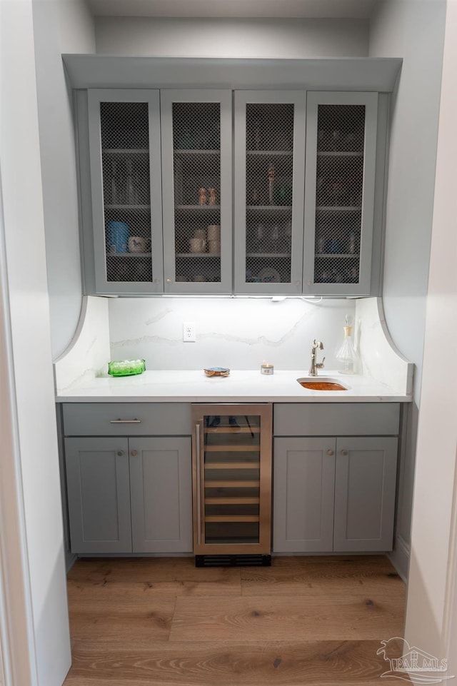 800 N Baylen St, Pensacola, FL 32501 - indoor wet bar with wine cooler and light wood-type flooring