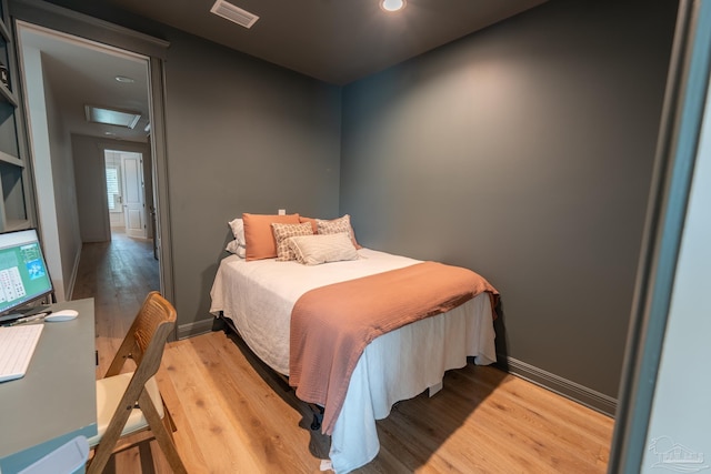800 N Baylen St, Pensacola, FL 32501 - bedroom with light wood-style floors, attic access, recessed lighting, and baseboards