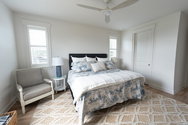 800 N Baylen St, Pensacola, FL 32501 - bedroom with multiple windows, wood finished floors, baseboards, and a ceiling fan