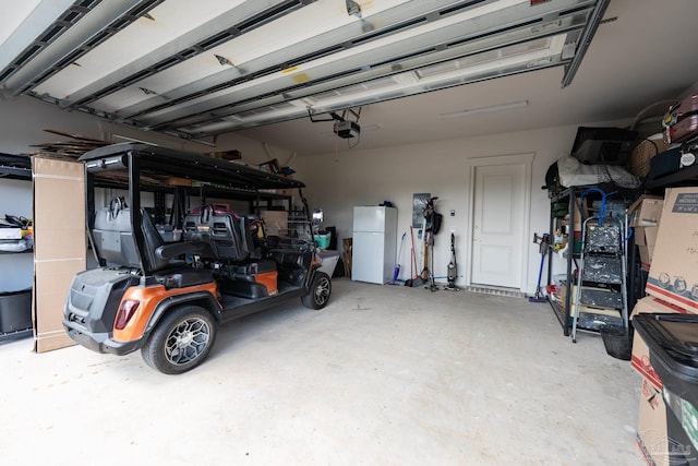 800 N Baylen St, Pensacola, FL 32501 - garage with freestanding refrigerator and a garage door opener