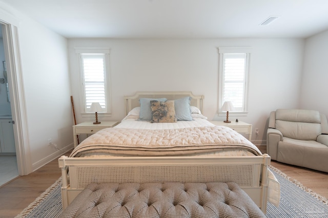 800 N Baylen St, Pensacola, FL 32501 - bedroom featuring light wood-style floors and multiple windows