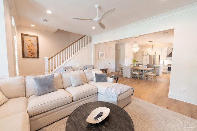 800 N Baylen St, Pensacola, FL 32501 - living area featuring light wood finished floors, a ceiling fan, stairs, recessed lighting, and ornamental molding
