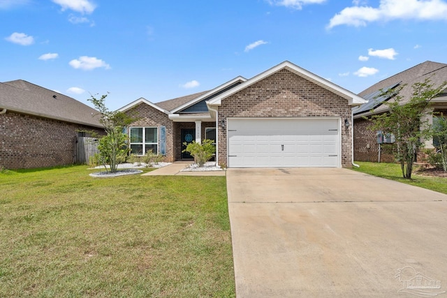5323 Red Shoulder Rd, Pace, FL 32571 - view of front of property featuring brick siding, a garage, concrete driveway, and a front yard