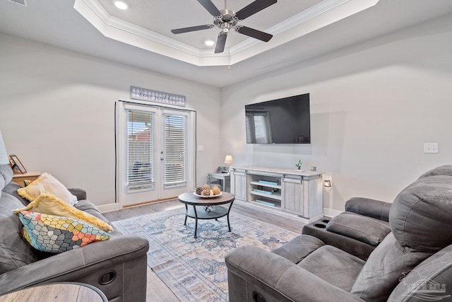 5323 Red Shoulder Rd, Pace, FL 32571 - living room featuring crown molding, light wood-style floors, recessed lighting, baseboards, and a raised ceiling