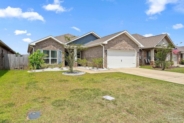 5323 Red Shoulder Rd, Pace, FL 32571 - craftsman-style house with brick siding, a garage, and driveway