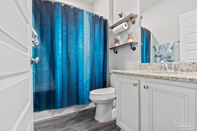5323 Red Shoulder Rd, Pace, FL 32571 - bathroom featuring wood finished floors, vanity, toilet, and shower / tub combo