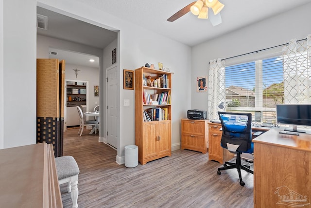 5323 Red Shoulder Rd, Pace, FL 32571 - office area featuring light wood-type flooring, a ceiling fan, and baseboards