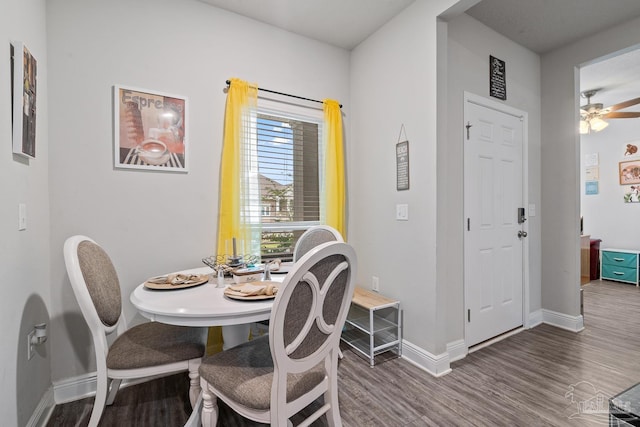 5323 Red Shoulder Rd, Pace, FL 32571 - dining space with wood finished floors, baseboards, and a ceiling fan