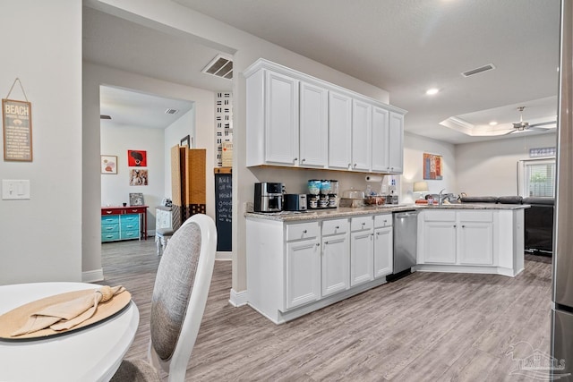 5323 Red Shoulder Rd, Pace, FL 32571 - kitchen featuring dishwasher, light wood finished floors, white cabinetry, a peninsula, and a tray ceiling