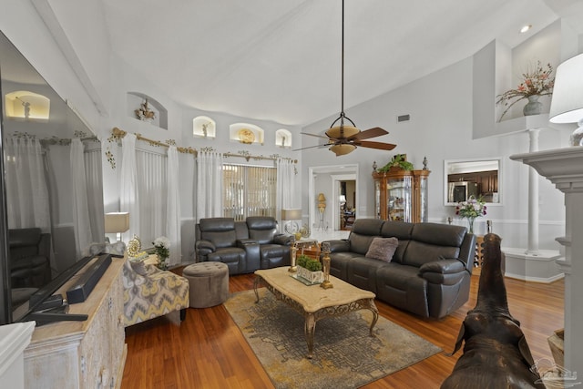 living room featuring ceiling fan, high vaulted ceiling, and hardwood / wood-style floors