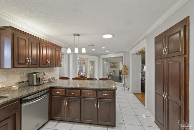 kitchen with dark stone counters, hanging light fixtures, ornamental molding, stainless steel dishwasher, and kitchen peninsula