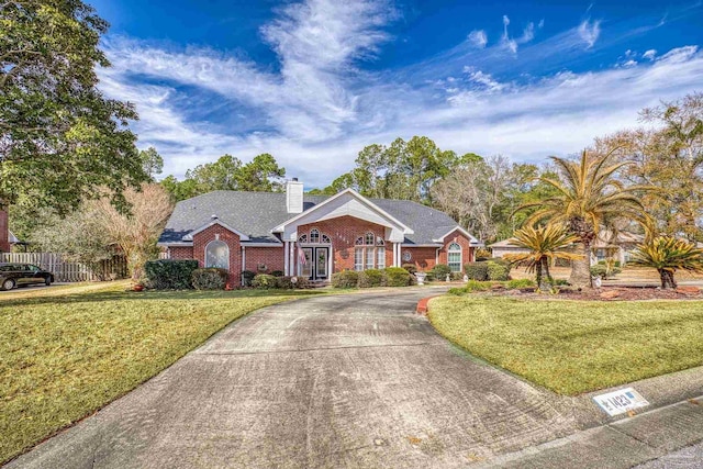 ranch-style home with a front yard