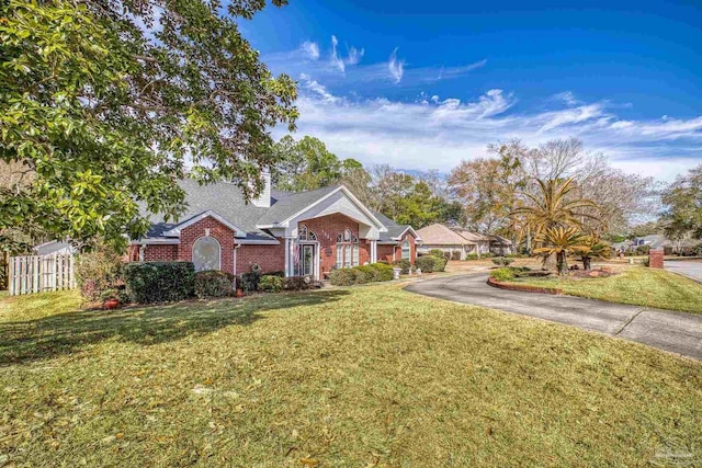 single story home with a front yard