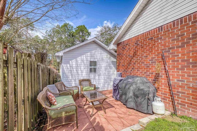 view of patio / terrace featuring an outdoor living space and grilling area