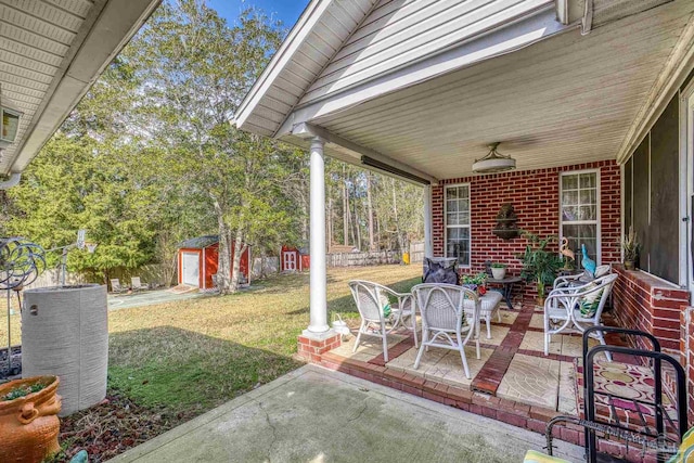 view of patio with a storage shed