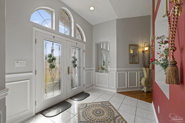 tiled foyer featuring french doors