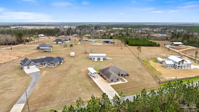 birds eye view of property with a rural view