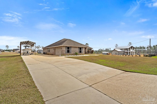 view of front facade with a front lawn and a carport