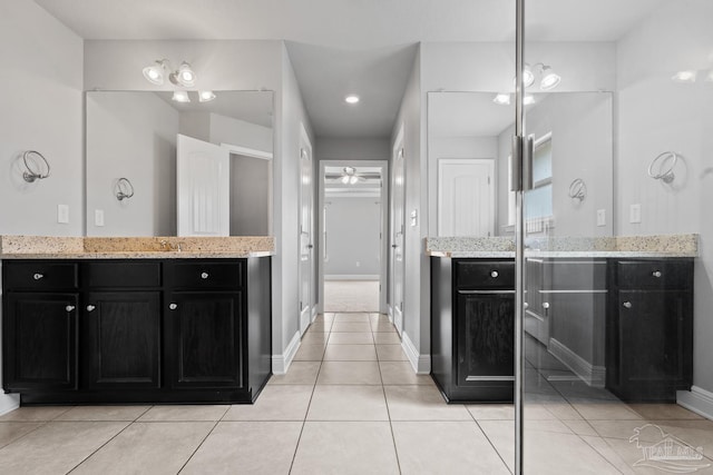 bathroom with ceiling fan, tile patterned floors, and vanity