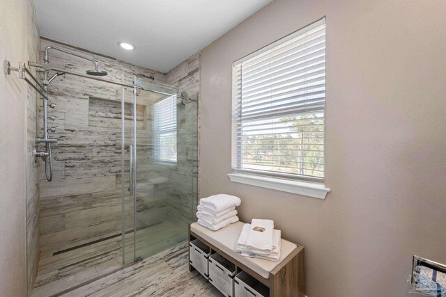35868 Boykin Blvd, Lillian, AL 36549 - bathroom with a stall shower and wood finished floors